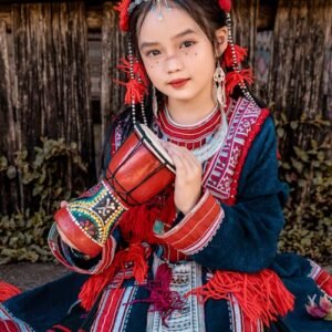 Vietnam - Ethnic Minority Beauty
Red embroidered costume with silver jewelry, traditional drum—mountain tribe elegance